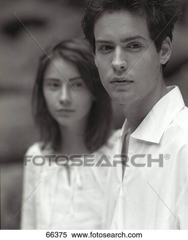 Stock Photography - Close-up of brother and sister looking sad . Fotosearch