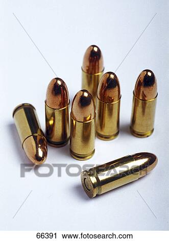 Stock Image - Close-up of bullets on white background . Fotosearch