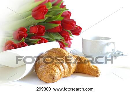 Close-up of bunch of flowers with croissant and coffee cup View Large Photo Image Stock Image - Close-up of bunch of flowers with croissant and coffee cup . Fotosearch