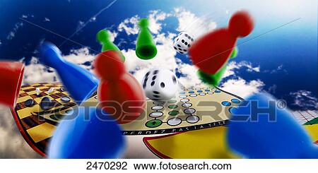 Stock Image - Close-up of checker board with game pieces and dices . Fotosearch