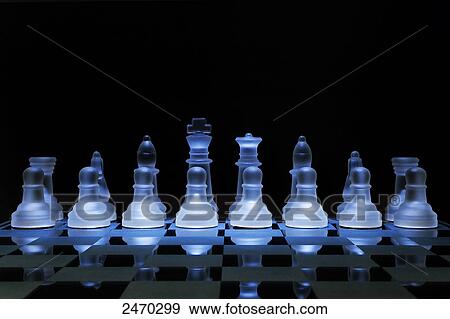 Stock Photo - Close-up of chess pieces on chessboard . Fotosearch
