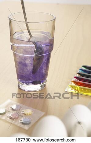 Close-up of cup of dye and eggs View Large Photo Image Stock Image - Close-up of cup of dye and eggs . Fotosearch