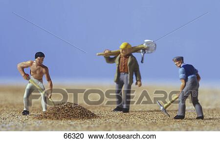 Stock Image - Close-up of figurines of construction workers . Fotosearch