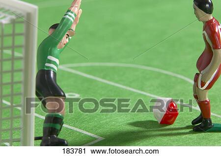 Stock Image - Close-up of figurines of soccer players . Fotosearch