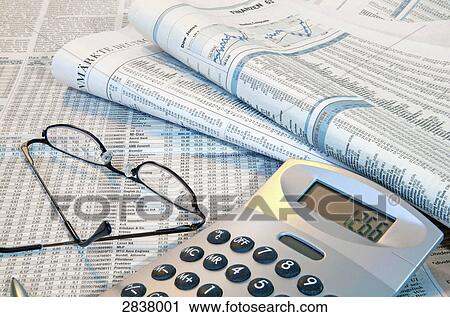 Close-up of financial newspapers with eyeglass and calculator View Large Photo Image Stock Image - Close-up of financial newspapers with eyeglass and calculator . Fotosearch
