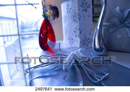 Close-up of flowers in vase and shopping bag beside it View Large Photo Image Stock Image - Close-up of flowers in vase and shopping bag beside it . Fotosearch