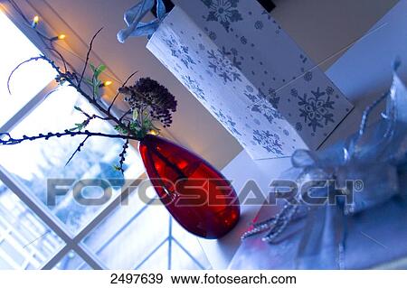 Close-up of flowers in vase and shopping bag beside it View Large Photo Image Stock Photo - Close-up of flowers in vase and shopping bag beside it . Fotosearch