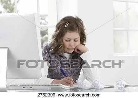 Close-up of girl studying at table View Large Photo Image Stock Photo - Close-up of girl studying at table . Fotosearch