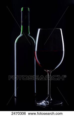 Close-up of glass and bottle of red wine View Large Photo Image Stock Photograph - Close-up of glass and bottle of red wine . Fotosearch