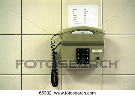 Close-up of phone against tiled wall View Large Photo Image Stock Image - Close-up of phone against tiled wall . Fotosearch