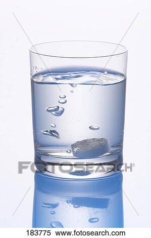 Close-up of pill and bubbles in glass of water View Large Photo Image Stock Photography - Close-up of pill and bubbles in glass of water . Fotosearch