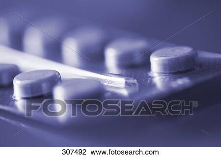 Stock Image - Close-up of pills in blister pack . Fotosearch