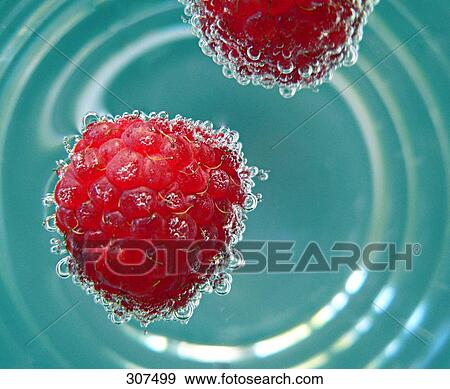 Stock Photo - Close-up of raspberries and water . Fotosearch