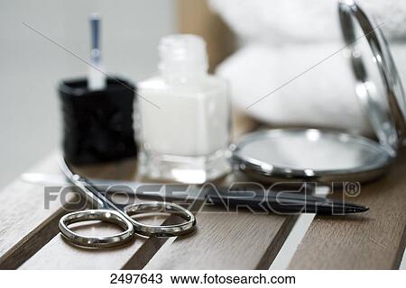 Close-up of scissors and nail file with hand mirror View Large Photo Image Stock Image - Close-up of scissors and nail file with hand mirror . Fotosearch