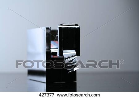 Stock Photo - Close-up of tape dispenser . Fotosearch