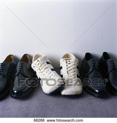 Close-up of three pairs of shoes View Large Photo Image Stock Photograph - Close-up of three pairs of shoes . Fotosearch