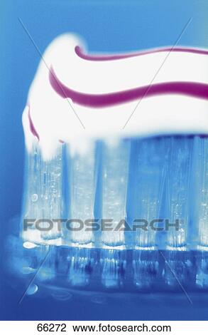 Stock Image - Close-up of toothpaste on toothbrush . Fotosearch