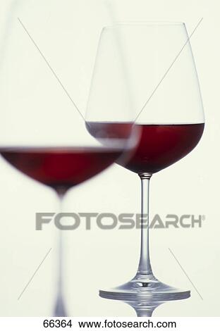 Close-up of two glasses of red wine View Large Photo Image Picture - Close-up of two glasses of red wine . Fotosearch