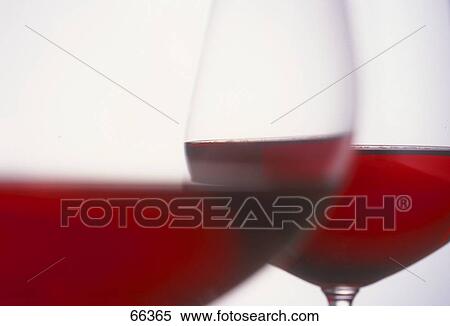 Close-up of two glasses of red wine View Large Photo Image Stock Photography - Close-up of two glasses of red wine . Fotosearch