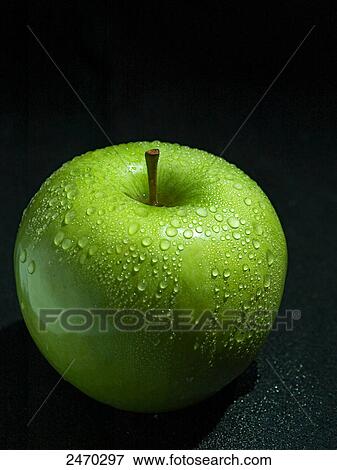 Close-up of water droplets on green apple View Large Photo Image Stock Photo - Close-up of water droplets on green apple . Fotosearch