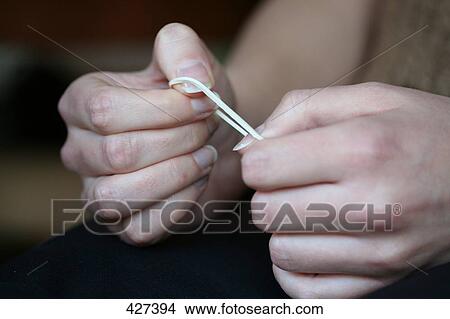 Close-up of woman stretching elastic View Large Photo Image Picture - Close-up of woman stretching elastic . Fotosearch