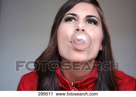Close-up of young woman blowing a bubble of bubble gum View Large Photo Image Stock Image - Close-up of young woman blowing a bubble of bubble gum . Fotosearch