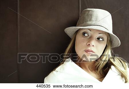 Stock Photography - Close-up of young woman glancing sideways . Fotosearch