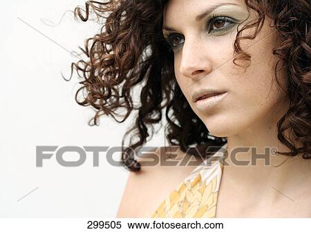 Stock Photography - Close-up of young woman looking serious . Fotosearch