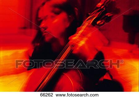 Close-up of young woman playing violin View Large Photo Image Stock Image - Close-up of young woman playing violin . Fotosearch