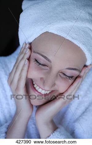 Stock Image - Close-up of young woman smiling . Fotosearch