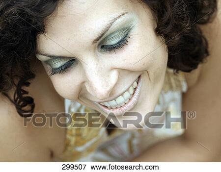 Stock Photo - Close-up of young woman smiling . Fotosearch