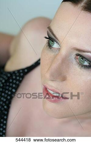 Close-up of young woman smiling View Large Photo Image Stock Photo - Close-up of young woman smiling . Fotosearch