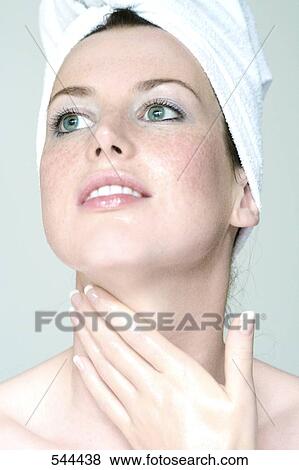 Close-up of young woman smiling View Large Photo Image Stock Photo - Close-up of young woman smiling . Fotosearch