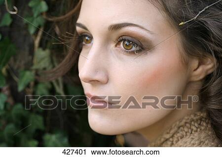 Close-up of young woman thinking View Large Photo Image Stock Image - Close-up of young woman thinking . Fotosearch