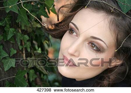 Stock Photo - Close-up of young woman thinking . Fotosearch