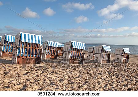 Closed beach chairs at the beach of Binz, Ruegen, Germany View Large Photo Image Picture - Closed beach chairs at the beach of Binz, Ruegen, Germany . Fotosearch