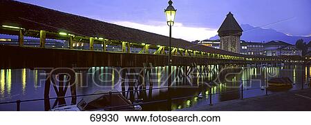 Covered bridge across river at night, Chapel Bridge, Reuss River, Lucerne, Switzerland View Large Photo Image Stock Image - Covered bridge across river at night, Chapel Bridge, Reuss River, Lucerne, Switzerland . Fotosearch