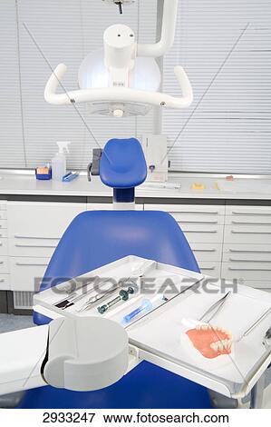 Dental chair and surgical instruments in a dental surgery View Large Photo Image Stock Photo - Dental chair and surgical instruments in a dental surgery . Fotosearch