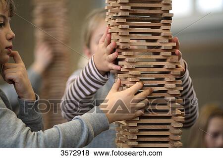 Elementary school students constructing towers from wooden parts, Friedheimschule, Flensburg, Schleswig-Holstein, Germany, Europe View Large Photo Image Stock Photo - Elementary school students constructing towers from wooden parts, Friedheimschule, Flensburg, Schleswig-Holstein, Germany, Europe . Fotosearch