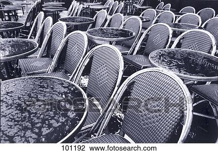 Empty chairs and tables at sidewalk cafe View Large Photo Image Stock Image - Empty chairs and tables at sidewalk cafe . Fotosearch