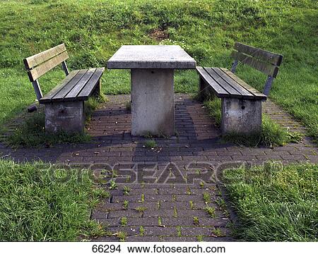 Empty picnic table on grassy landscape View Large Photo Image Picture - Empty picnic table on grassy landscape . Fotosearch