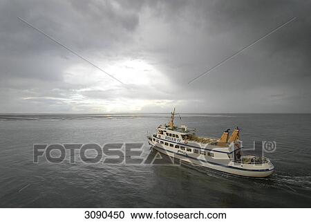 Stock Image - Ferry on north sea, Amrum, Germany . Fotosearch