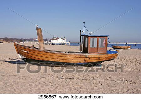 Fishing boat with pier in the background, Ahlbeck, Usedom, Germany View Large Photo Image Stock Photo - Fishing boat with pier in the background, Ahlbeck, Usedom, Germany . Fotosearch