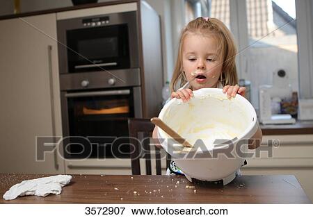 Girl baking cake View Large Photo Image Stock Photo - Girl baking cake . Fotosearch