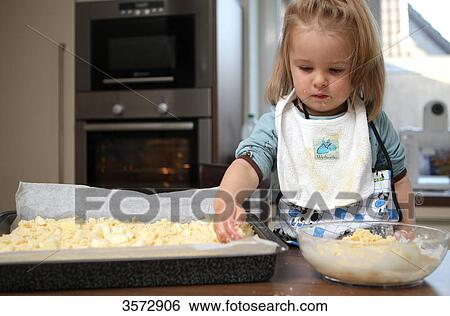 Girl baking cake View Large Photo Image Stock Photograph - Girl baking cake . Fotosearch