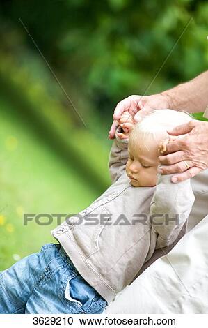 Grandfather helping toddler to walk View Large Photo Image Stock Image - Grandfather helping toddler to walk . Fotosearch
