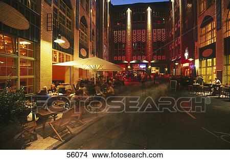 Picture - Group of people sitting at sidewalk cafe, Berlin, Germany, Europe . Fotosearch