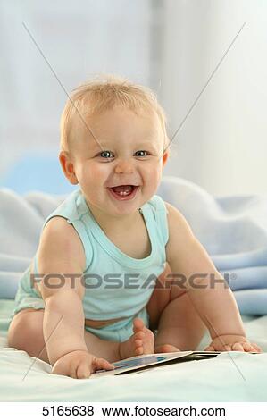 Happy blond baby View Large Photo Image Stock Photo - Happy blond baby . Fotosearch