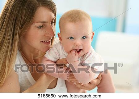 Happy mother with baby View Large Photo Image Stock Image - Happy mother with baby . Fotosearch