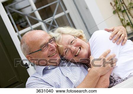 Happy senior couple outdoors, portrait View Large Photo Image Stock Image - Happy senior couple outdoors, portrait . Fotosearch